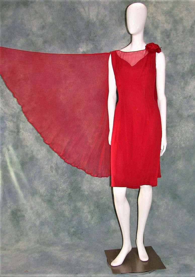 Red Silk Chiffon and Crepe 1960s Party Dress with Self: red silk chiffon over crepe with two long self scarves attached at the neck, one side has two large floral rosettes, metal zipper in back, measures 40"L X 36"B X 30"W X 38"H, 14" shoulder to shoulder