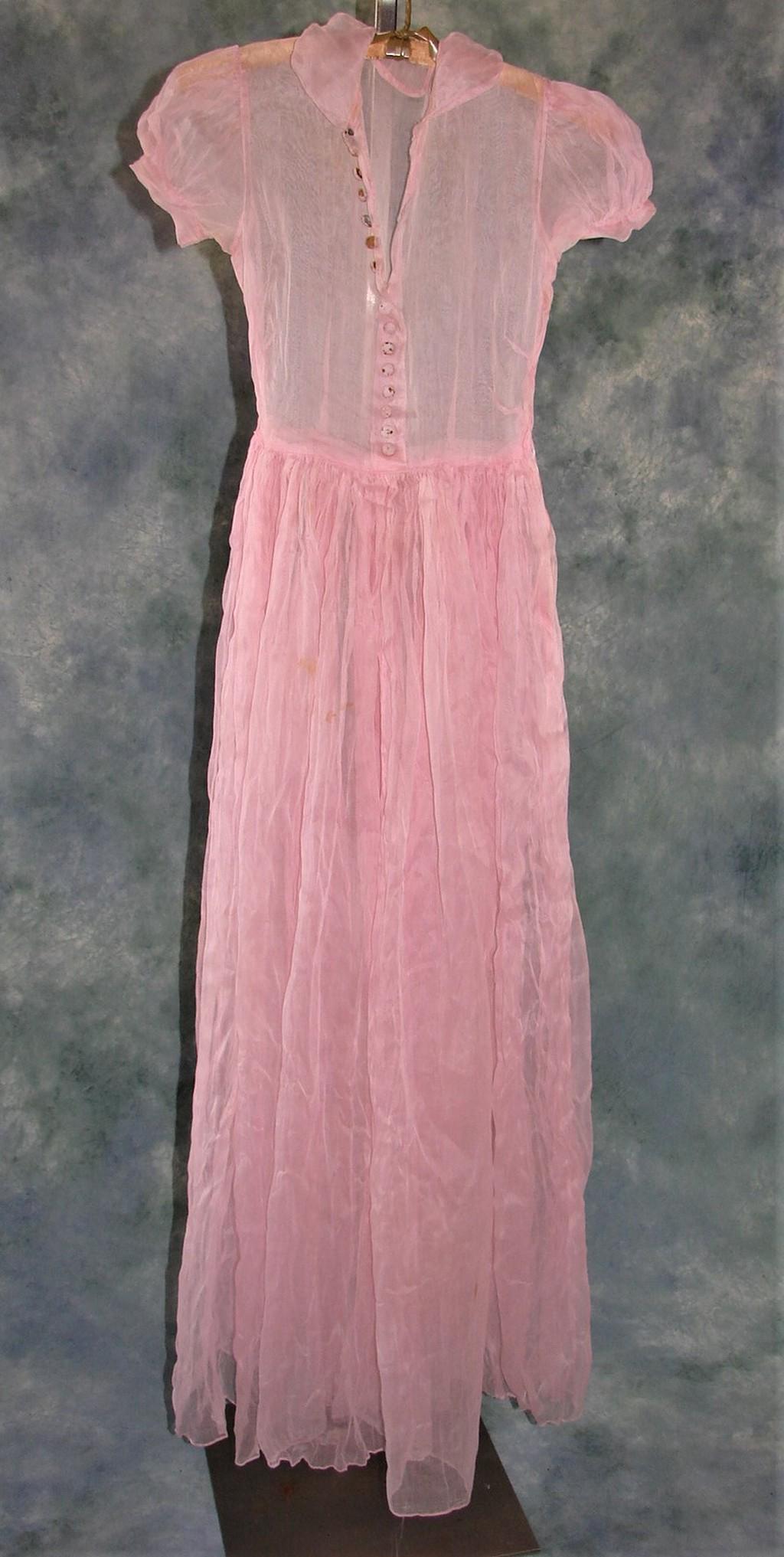 Ladies 1930s Pink Batiste Gown: Has small cap sleeves, a metal zipper on the side, 16 fabric covered snap buttons on the bodice (need to be replaced due to rusting) and is gathered under the empire waist. Measures 56" long, 32" bust