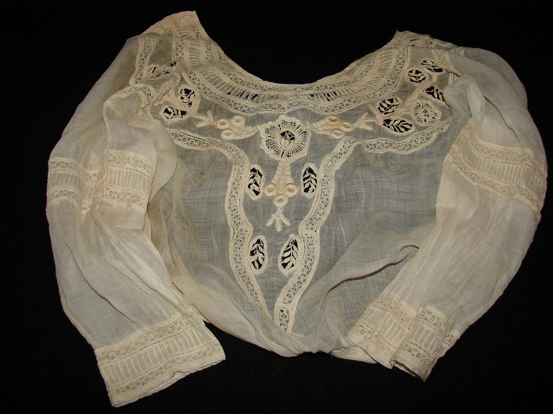 Edwardian Blouse with Raised Embroidery, Inserted Lace,: fine lawn like a gauze, tea dyed, raised embroidery with inserted lace at collar, above elbows and cuffs, seven tiny buttons and hooks and eye, 16"L X 36"B X 22"W X 16" sleeves. Provenance: Edith Lott