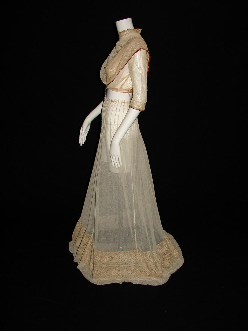 Edwardian Net 2 Piece Skirt and Fitted Blouse, Circa: Skirt is constructed of a cotton net with pleats at the waist and an applied crochet flounce, measures 24" waist x 40" in the front x 43" in the back closes with hook and eyes. Top is same net that ha