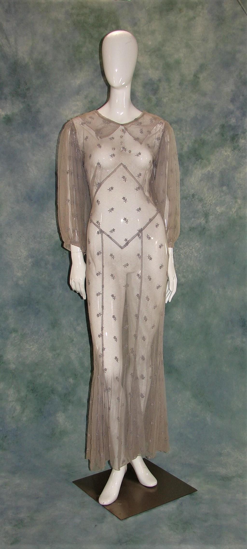 Ladies 1930s Bias Cut Lavender Net Dress with Allover: Has a pointy collar, 6 rhinestone buttons on yoke, inserted panels at hem, closes with two snaps and one hook on the side, keyhole button closure at the back neck, very tiny rouching at shoulders and 