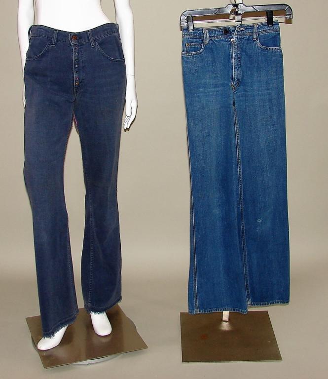 2 Pair Of Denim Jeans, Patches 60s-70s: Pair of Levis bellbottoms with label jeans with patch under leg, colorful beads sewn to zipper cover and at ankle, zipper with button, frayed hem43"L x 32" W X Pair of N EST CE PAS blue jeans w/Devil 
