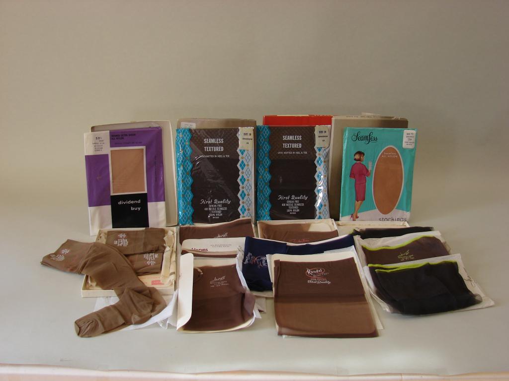 Generous Lot of Vintage Nylons: 1) Pair of Sheer Randel Stockings in box2) 2 Pairs of navy blue stockings 3) 1 Pair of Shadowtones4) Sears box with 3 pairs5) 2 packages of seamless textured6) 1 package of seamed ultrasheer7) 1 packa