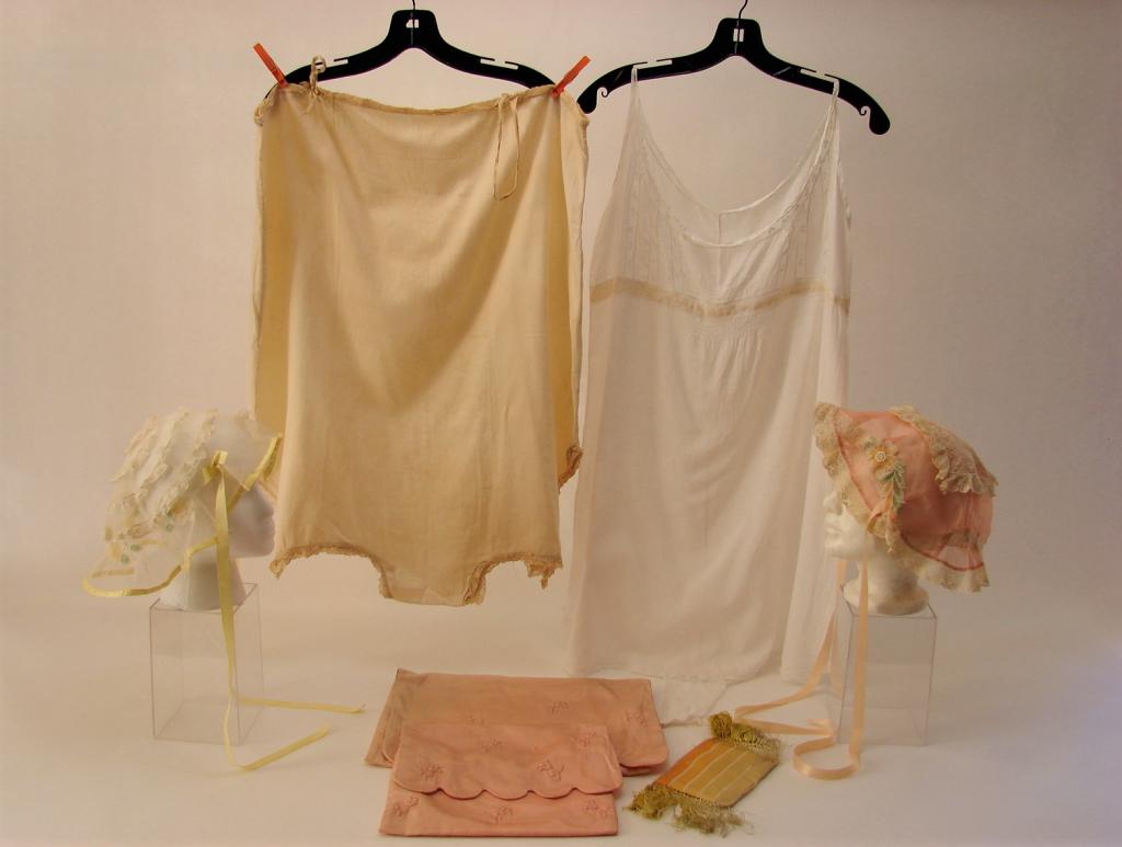 1920s Lingerie Bags, Step-Ins, Boudoir Caps: Includes 2 silk satin lingerie bags, 1) gold striped polished cotton step in 33" L x 48" B x 52" W 60" H2) Fine white lawn step in, inserted heart shaped lace 36" L x 40" B x 40" W x 44" H3) Boudoir c