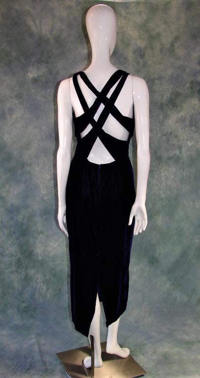 Vintage Purple Velvet Evening Gown: vintage Purple velvet like fabric with a criss-cross design in the back, a V neck, 4 rhinestone buttons in the front, small zipper at the lower back, made by Alyn Paige 50" L x 36" B x 30" W x 36" H, 
