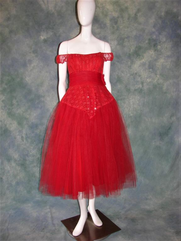 1950s Red Tulle, Lace, Rhinestone Party Dress: Vintage dress in red Tulle confection with a corset bodice with stays, shoulder wrap, elastic shoulder straps, covered with prong set rhinestones, has a cummerbund waist, yards and yards of tulle in 2