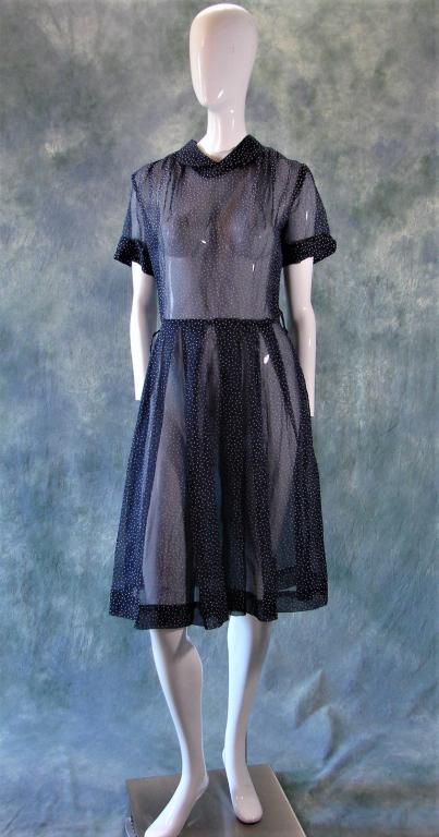 1940s Blue and White Polka Dot Dress: By Kerrybrooke, blue net dress with white painted polka dots, skirt has pleats, pleated over the shoulders, Peter Pan collar, zips down the back with a metal zipper 42" L x 36" B x 26" W