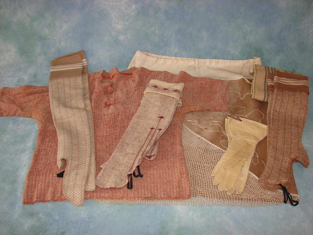 Lot Of Hand Knits, 1930s: 1) Pink and creme knitted sweater 2) Knitted scarf by Horkshire 3) 3 Pair of spats 4) Pair of leather gloves 5) Large cotton linen bag wth twisted and knotted lace work and embroidery provenance: Mabe