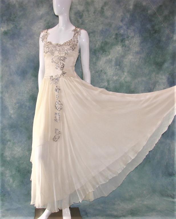 Vintage Cream Beaded Gown Dress: Late 1940s, long gown that has applied applique multiple bead styles and sequins, the skirt has an additional feature of a panel that wraps half way around the body, net over a rayon or blend, closes 