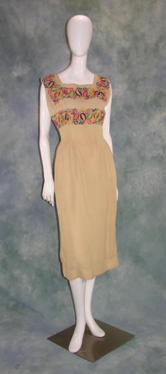 Ann Fogerty Linen and Embroidered Dress: 1970s, fully lined, measures 45" long, 36" bust, 30" waist. Zips up the back and closes with a hook and eye.