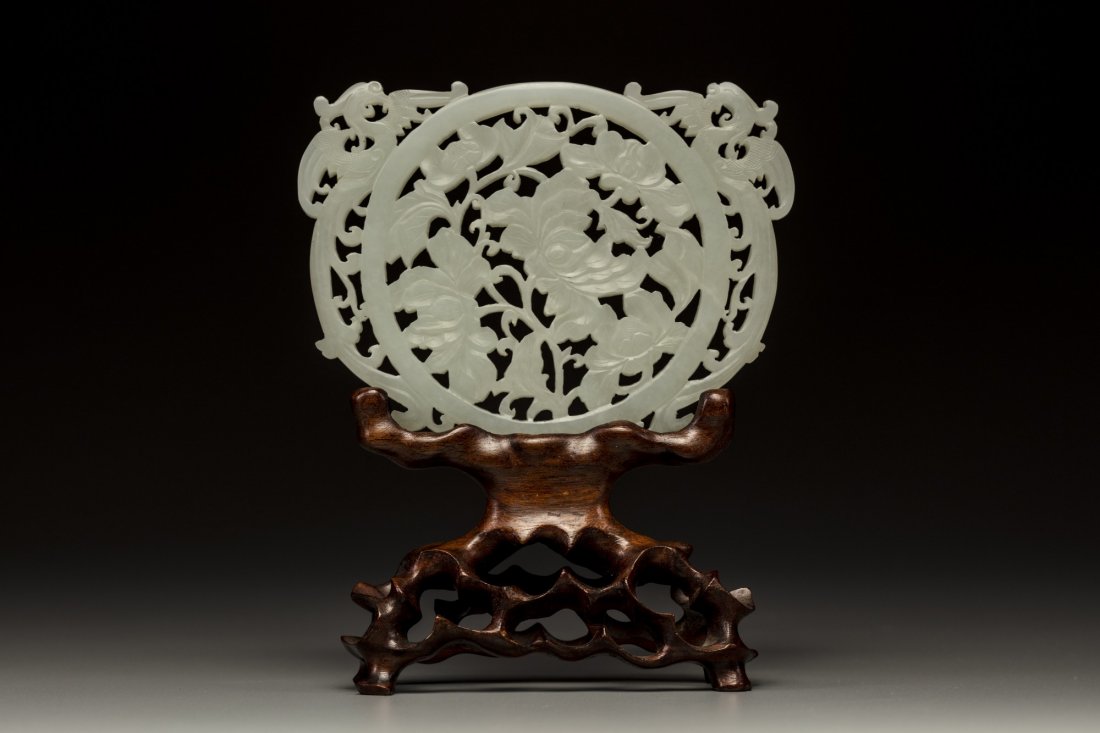A large pale celadon jade openwork plaque (1 of 2)