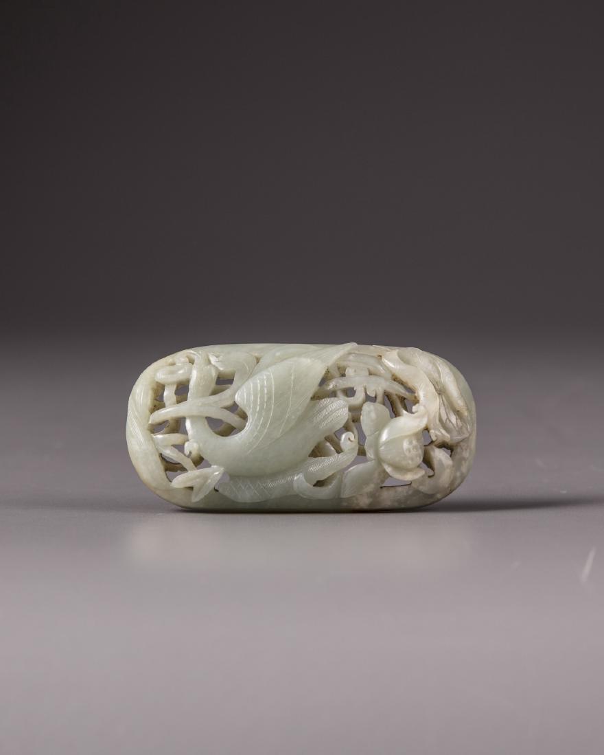 A Chinese celadon jade 'duck and lotus' plaque (1 of 3)