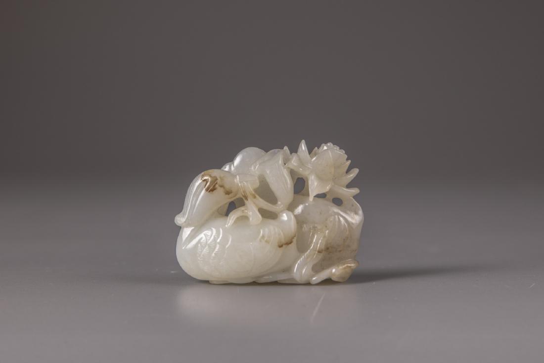 A white and russet jade 'mandarin ducks and lotus' (1 of 2)