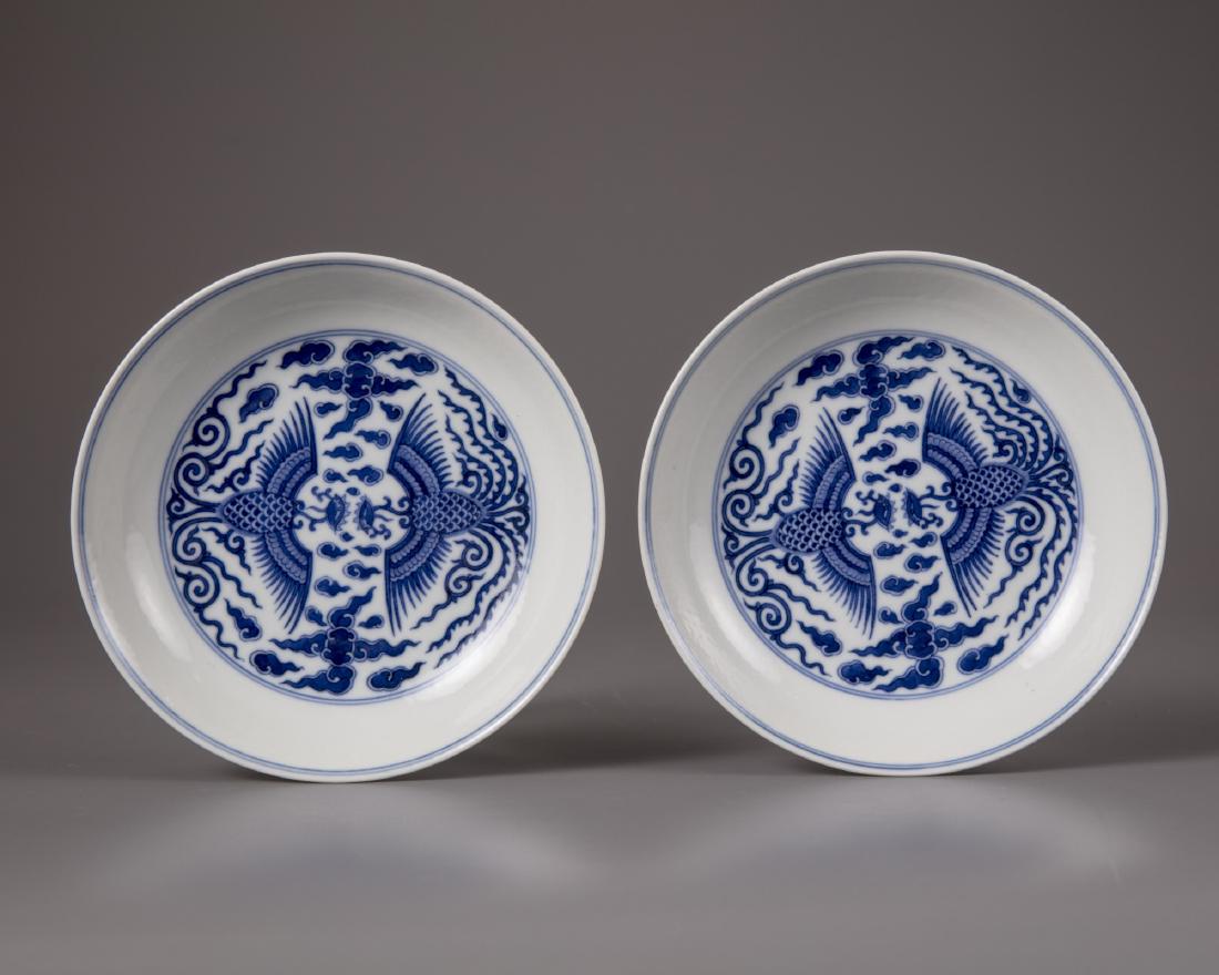A pair of Chinese blue and white 'phoenix' dishes (1 of 2)