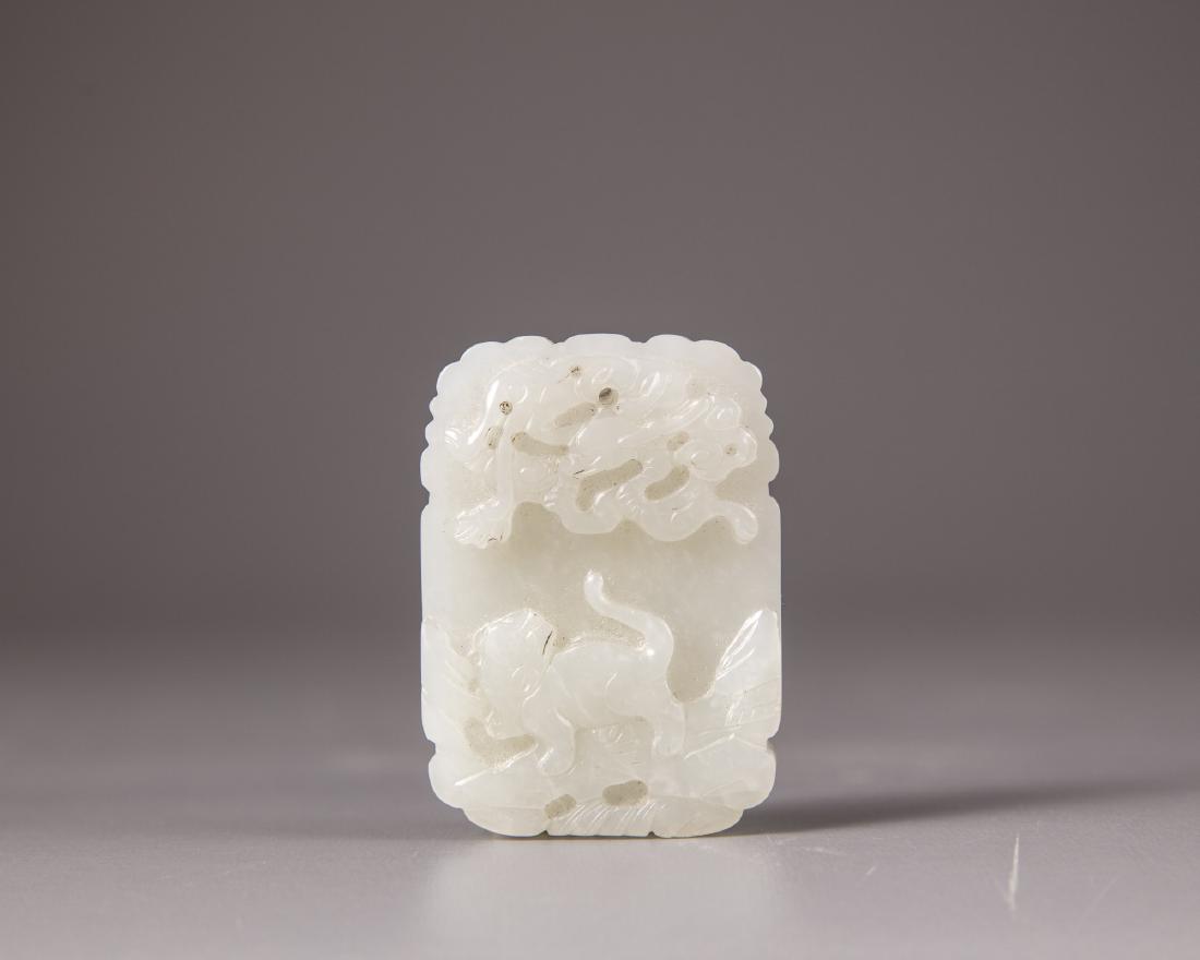 A Chinese very pale celadon jade 'tiger and phoenix' (1 of 2)