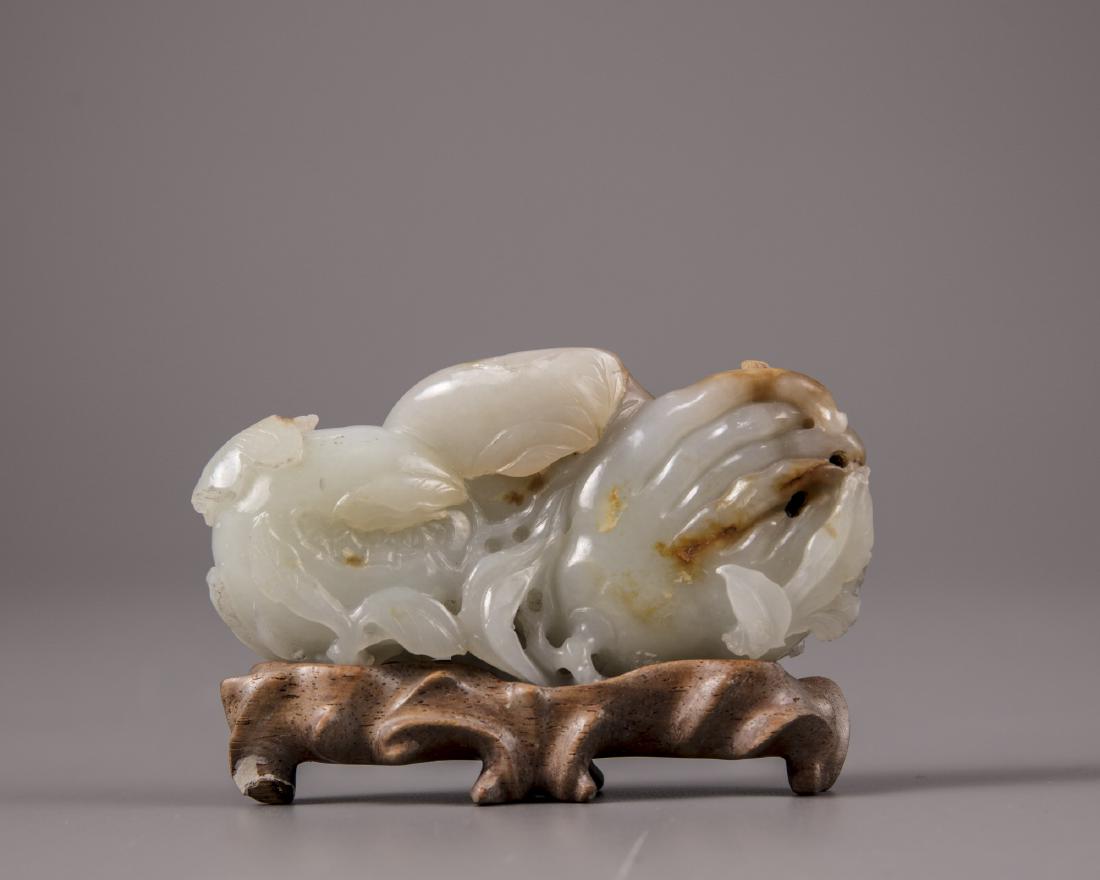 A Chinese white and russet jade 'Three Abundances' (1 of 4)