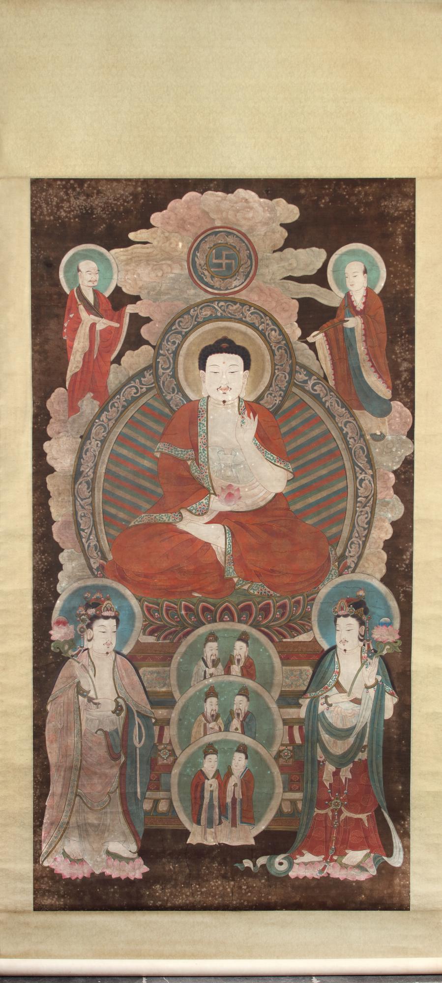 A KOREAN 'BUDDHIST' HANGING SCROLL: Ink and colour on paper. Depicting of Amitabha in the centre seated in dhyanasana with one hand in bhumiparsamudra supporting a lotus flower and the other in vitarkamudra. He is surrounded by further 