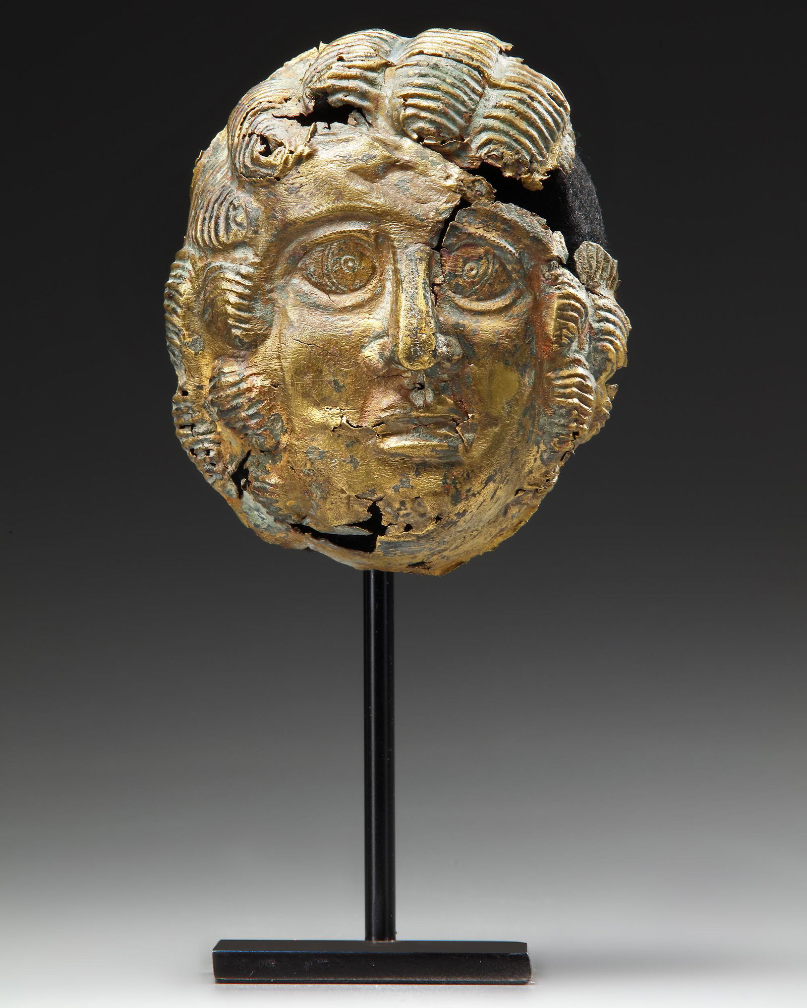 A GRECO-ROMAN GILT BRONZE MASK, CIRCA 1ST CENTURY B.C. / A.D. (1 of 5)