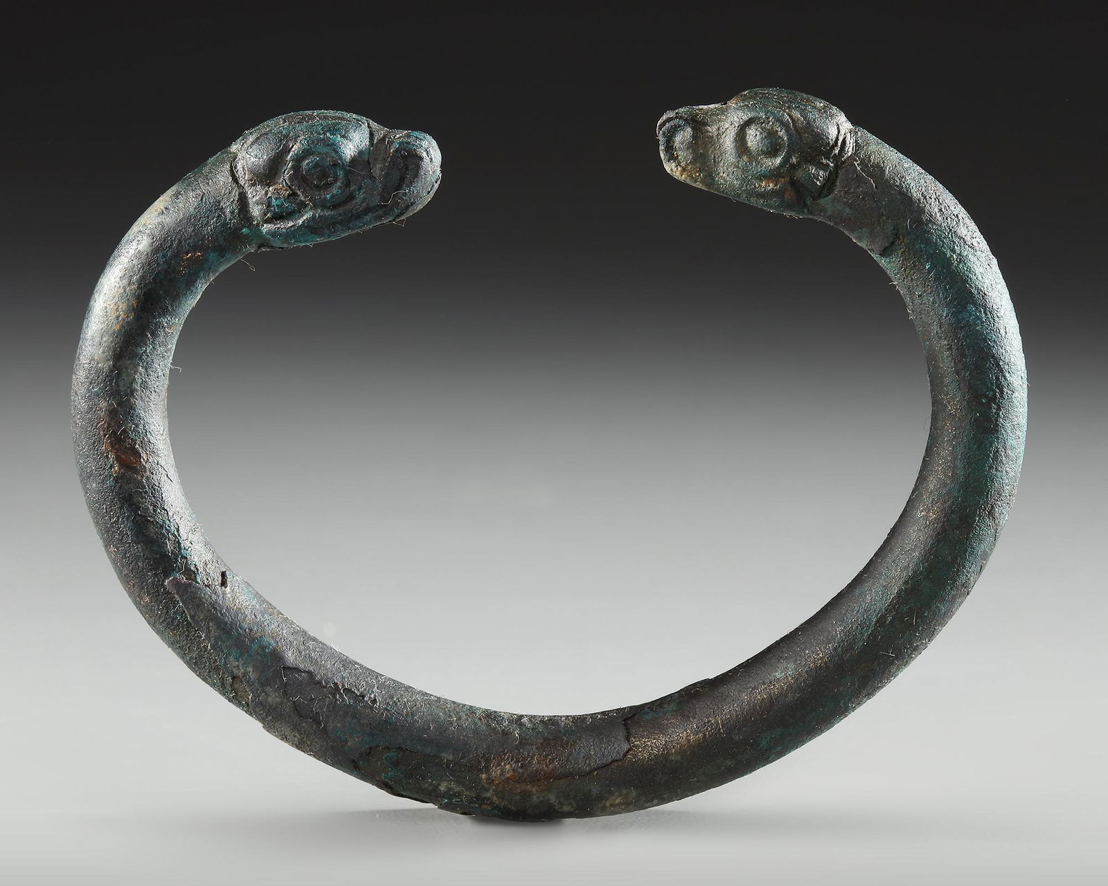AN URARTIAN BRONZE BRACELET WITH DECORATED FINIALS, CIRCA 9TH-6TH CENTURY B.C. (1 of 2)