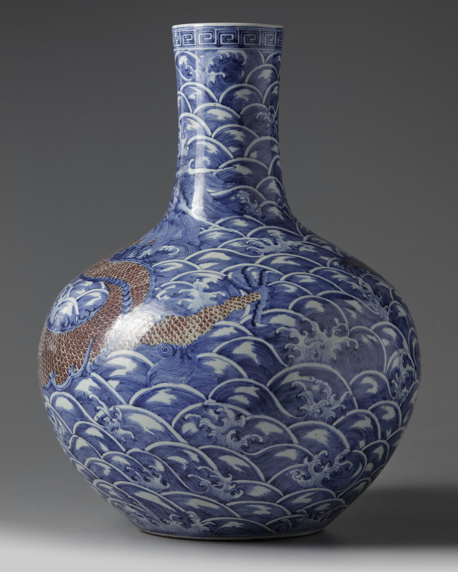 A LARGE CHINESE UNDERGLAZE COPPER RED AND BLUE AND WHITE 'DRAGON' VASE, QING DYNASTY (1644-1911) (1 of 5)
