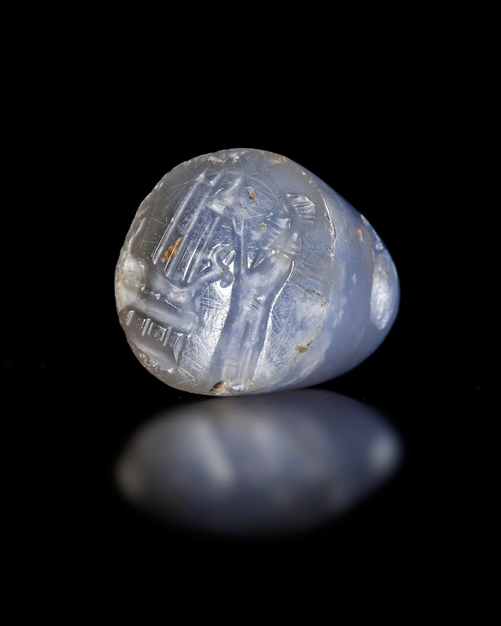 A BLUE CHALCEDONY NEO ASSYRIAN STAMP SEAL, 7TH-8TH CENTURY BC (1 of 2)
