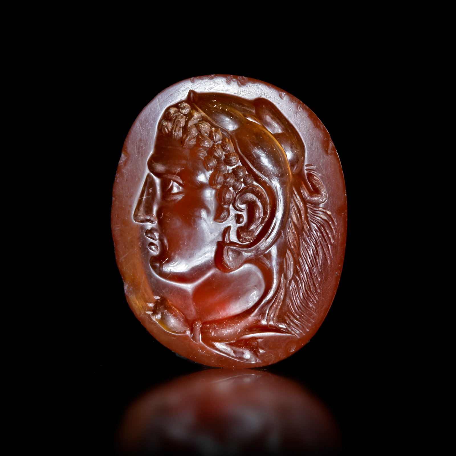 A ROMAN INTAGLIO WITH THE HEAD OF HERCULES POSSIBLY PORTRAYING ALEXANDER THE GREAT(?), 1ST CENTURY (1 of 4)