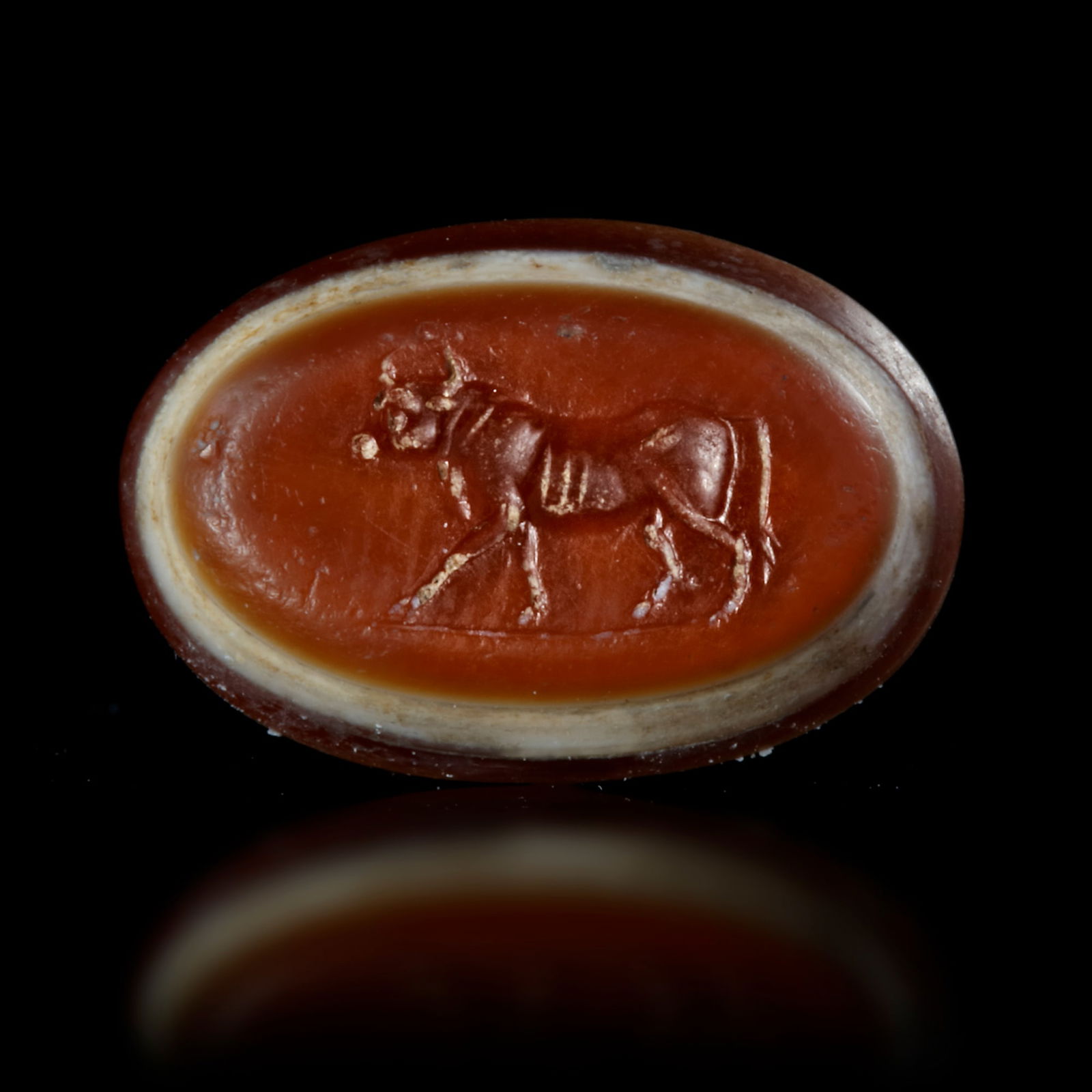 A ROMAN INTAGLIO WITH A WALKING BULL, 1ST CENTURY AD (1 of 4)