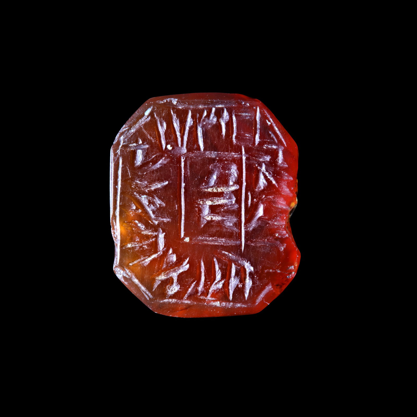 A CARNELIAN HEBREW SEAL, 16TH-17TH CENTURY AD: An octagonal carnelian seal with a Hebrew inscription around a central square panel which has two letters. This would have been a personal seal probably from early Ottoman times. It reads the proclama