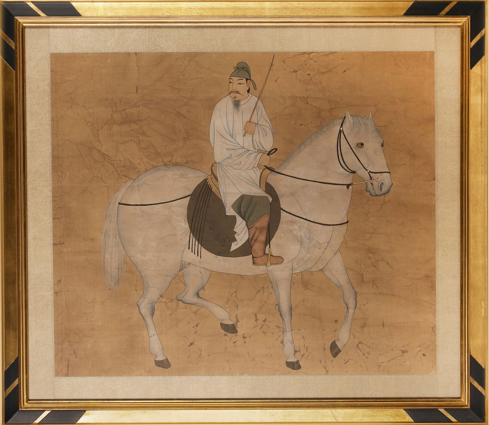 A CHINESE HORSE AND GROOM PAINTING AFTER HAN GAN, 19TH CENTURY: A Chinese Tang style painting of a horse and groom after Han Gan. Han was a painter of the Tang court and was known for his paintings of horses. Ink and color on silk type paper, framed and glazed. Pa
