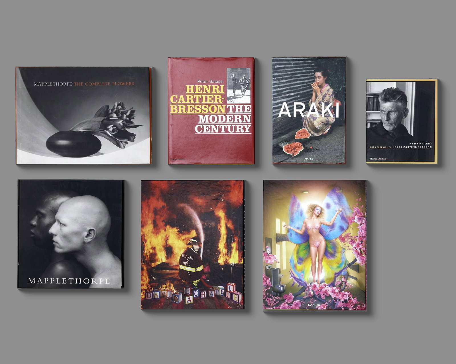 A COLLECTION OF SEVEN PHOTOGRAPHY BOOKS, FEATURING ICONIC PHOTOGRAPHERS AND THEIR WORK: 1.Mapplethorpe: The Complete Flowers•A comprehensive collection of Robert Mapplethorpe’s floral photography, showcasing his iconic black-and-white still lifes of flowers, known for their elegan