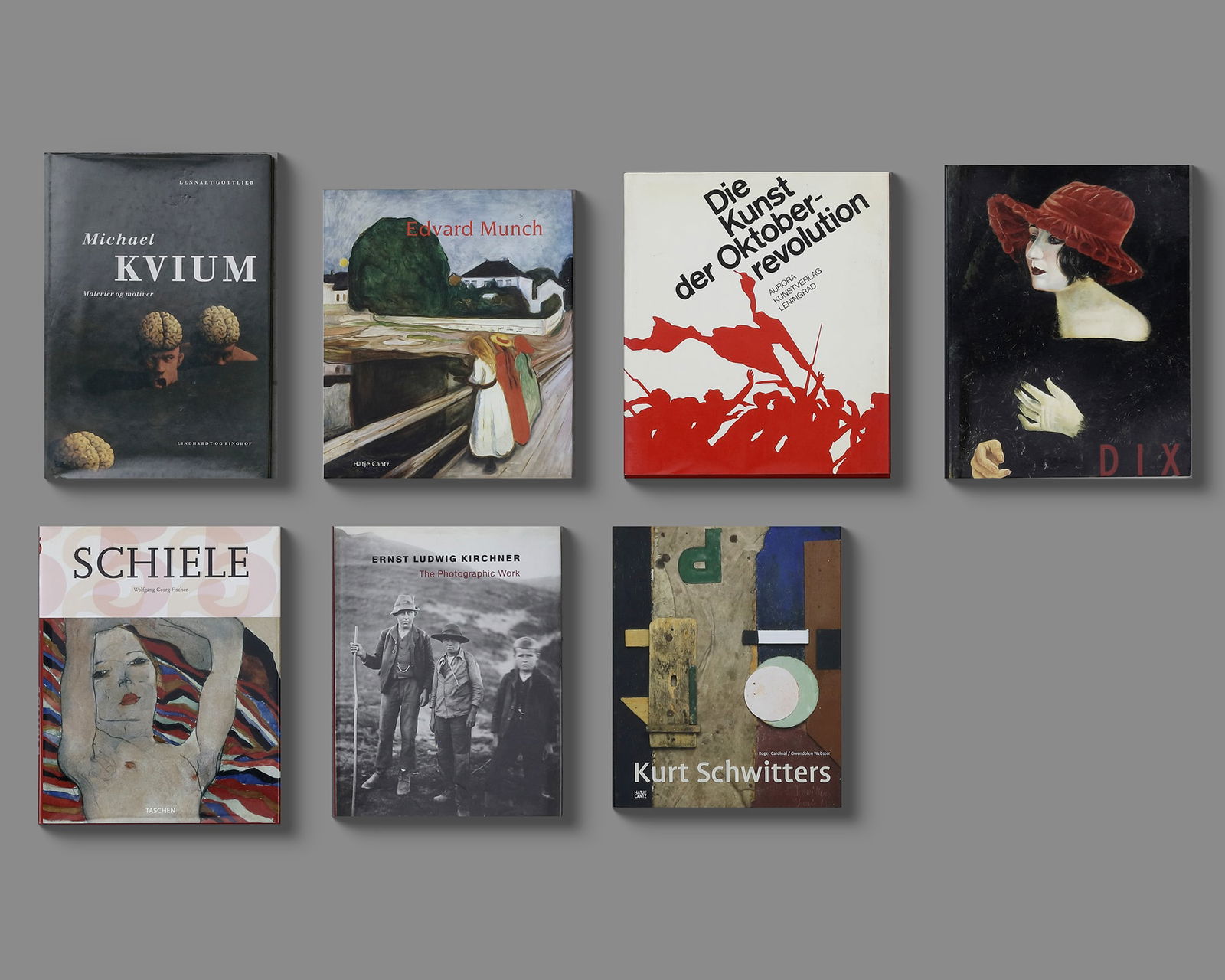 A COLLECTION OF SEVEN ART BOOKS ABOUT EDVARD MUNCH, KURT SCHWITTERS, SCHIELE AND OTHERS: 1.Michael Kvium: Malerier og Motiver•Author: Lennart Gottlieb•Focus: The work of Danish artist Michael Kvium, known for his grotesque, surrealist, and thought-provoking paintings.2.Edvard Mu