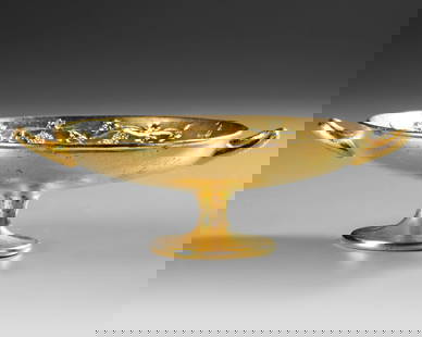 ILIAS LALAOUNIS (1920-2013), GOLD PLATED SILVER CUP IN THE SHAPE OF A RYLIX: After the original dating from 540-530 B.C. which is in the collection of the Museum for Alter Kleinkunst in Munich. This lot comes with an certificate of authenticitiy by LalaounisDiameter 14.3 cm.