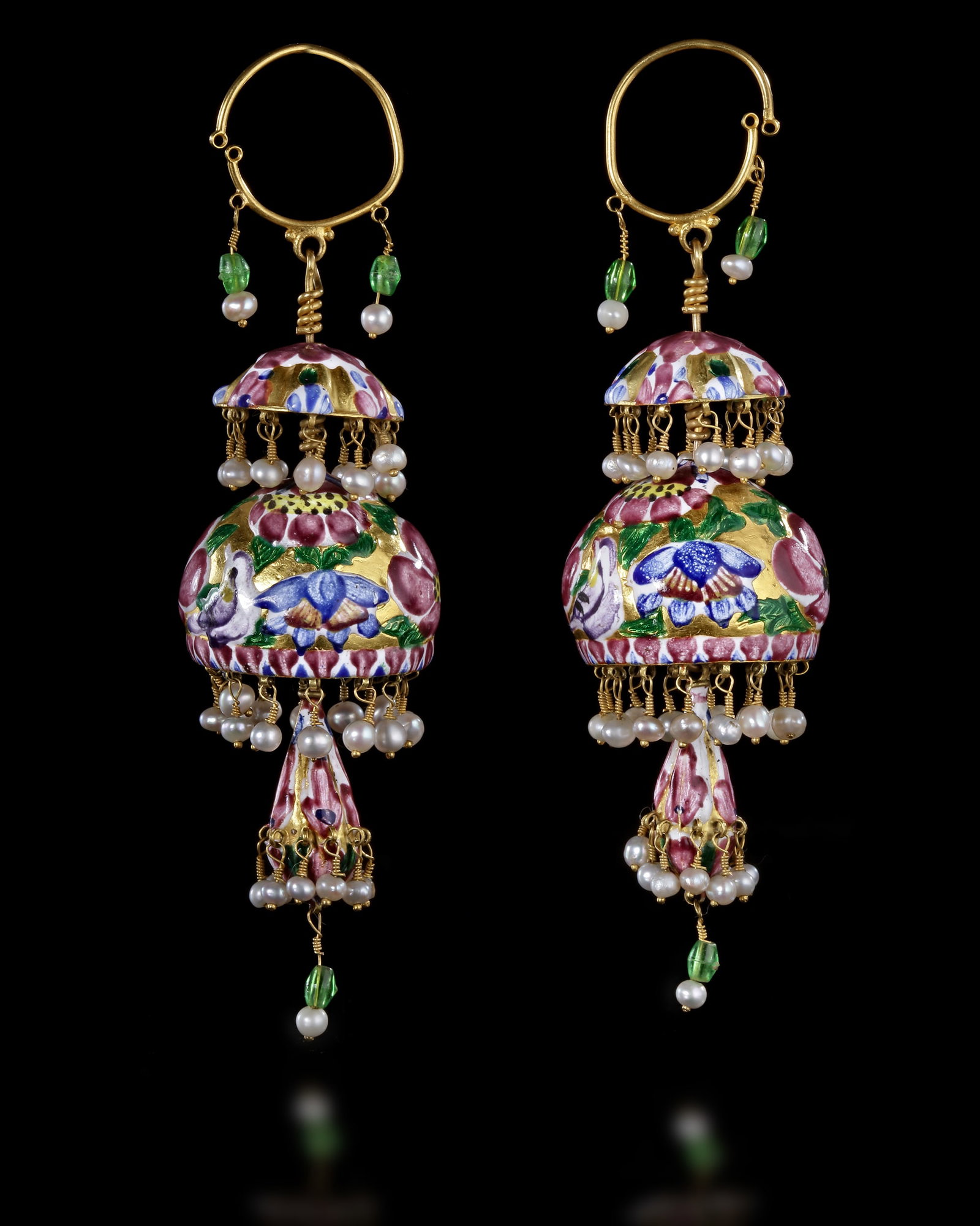 A PAIR OF ENAMELLED GOLD EARRINGS, QAJAR PERSIA, 19TH CENTURY: Each with an upper gadrooned shallow domed section above a larger well rounded domed element above a lower bell-shaped pendant, the main central element with polychrome enamelled flowering sprays abov