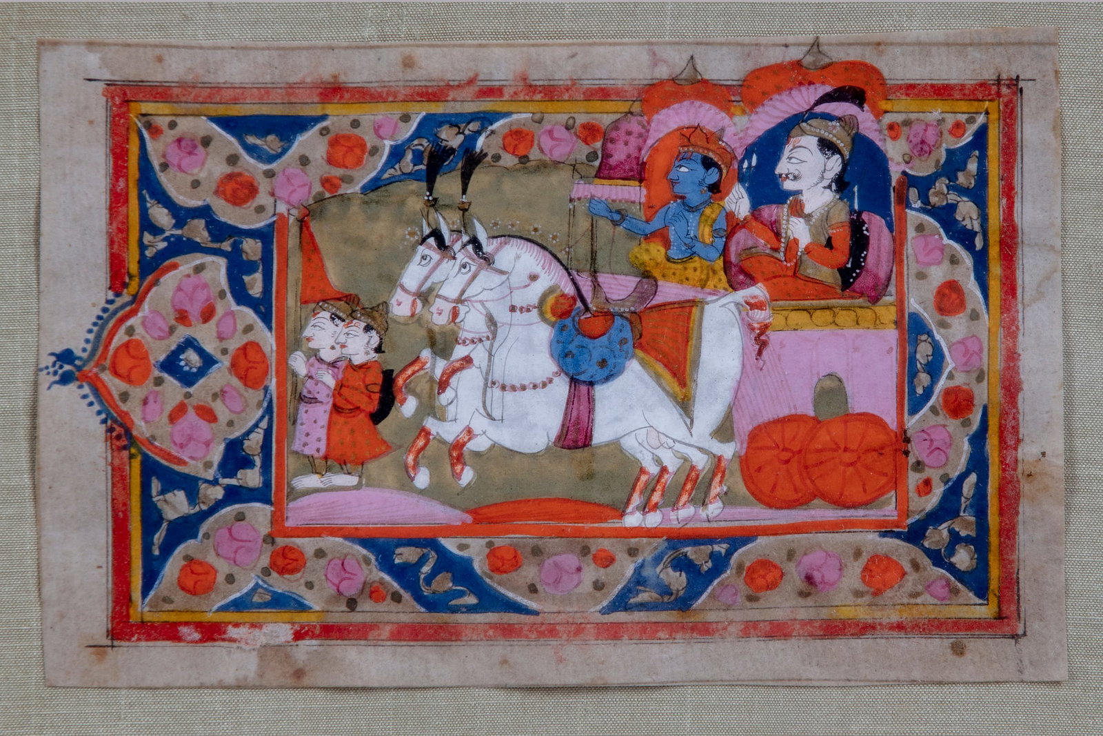AN INDIAN MINIATURE PAINTING,19TH CENTURY: Gouache on manuscript depicting a Maharaja seated with Krishna in a carriage with horses, natural pigments on paper. 12.5 by 7.5 cm.