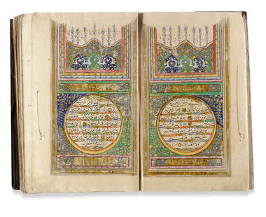 A FINE ILLUMINATED OTTOMAN QURAN, WRITTEN BY IBRAHIM VEHBI AND DATED 1279 AH/1862 AD: A complete Quran, Arabic manuscript on paper, 15 lines to each page in bold black naskh script within gilt and black borders. Surah headings in white thuluth script on a gilt panel, catchwords in red