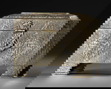 A SILVER-INLAID CAST BRASS CASKET, KHURASAN-STYLE, 20TH CENTURY: Of rectangular form, this intricately crafted brass box features a hinged, coffered lid and rests on four shaped feet. The surface is richly decorated with silver-inlaid roundels, each enclosing princ