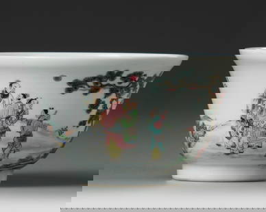 A CHINESE FAMILLE ROSE BOWL, 19TH-20TH CENTURY: A Chinese porcelain bowl resting on a small foot, decorated in famille rose enamels with scholars under a pine tree in a landscape, with a crane flying over a house amidst crushing sea waves. Height: