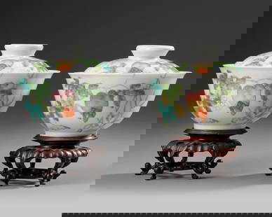 A PAIR OF CHINESE FAMILLE ROSE BOWLS AND COVERS, 19TH-20TH CENTURY: Each bowl is decorated on the exterior with butterflies and fruiting and flowering gourd vines which are repeated on the domed cover below the circular finial which encloses the seal mark. The bowl an