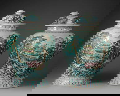 A PAIR OF CHINESE FAMILLE ROSE VASES WITH COVERS, 20TH CENTURY: A pair of Chinese porcelain vases, decorated in famille rose enamels with a continous scene of figures on terrace in large houses and amongst pine trees in a mountinous landscape, set between a band o