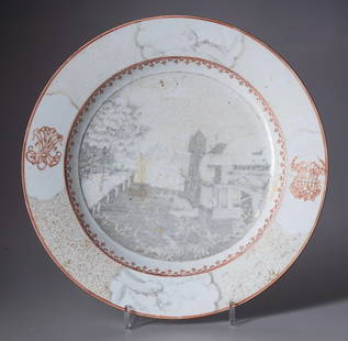 A LARGE CHINESE EXPORT PLATE, 18TH CENTURY: Decorated in grisaille depicting a water mill along a canal on the foreground and a river with a large building or church in the background, possibly a scene of Batavia.Diameter 39 cm.Heavily damaged.