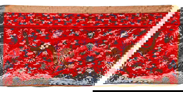 A CHINESE DRAGON EMBROIDERED PANEL, LATE QING DYNASTY (1644-1911): A Chinese panel embroidered in silk with two dragons chasing a flaming pearl amidst clouds and above crushing waves.190 by 90 cm.