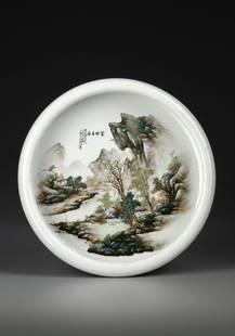 A CHINESE PORCELAIN BRUSH WASHER, REPUBLIC PERIOD: A Chinese porcelain brush washer decorated with two houses beside large trees in a river and mountain landscape. Diameter: 23 cm.PROVENANCE Private collection, Belgium