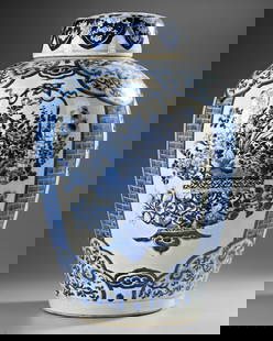 A LARGE CHINESE JAR WITH COVER, KANGXI PERIOD (1662-1722): A Chinese baluster-shaped vase with a cover, finely decorated in cobalt blue with panels featuring baskets overflowing with intricate flowers. The neck and base are adorned with bands of ruyi heads en