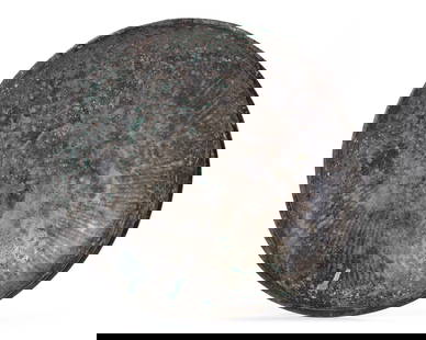 A HIGH TIN BRONZE SILVER DISH ACHAEMENID, 5TH CENTURY BC: A large shallow bronze bowl, plain on the outside and decorated with shallow ribbing on the inside. At the centre there are two concentric circles and the edge of the bowl tapers to a smooth flat edge