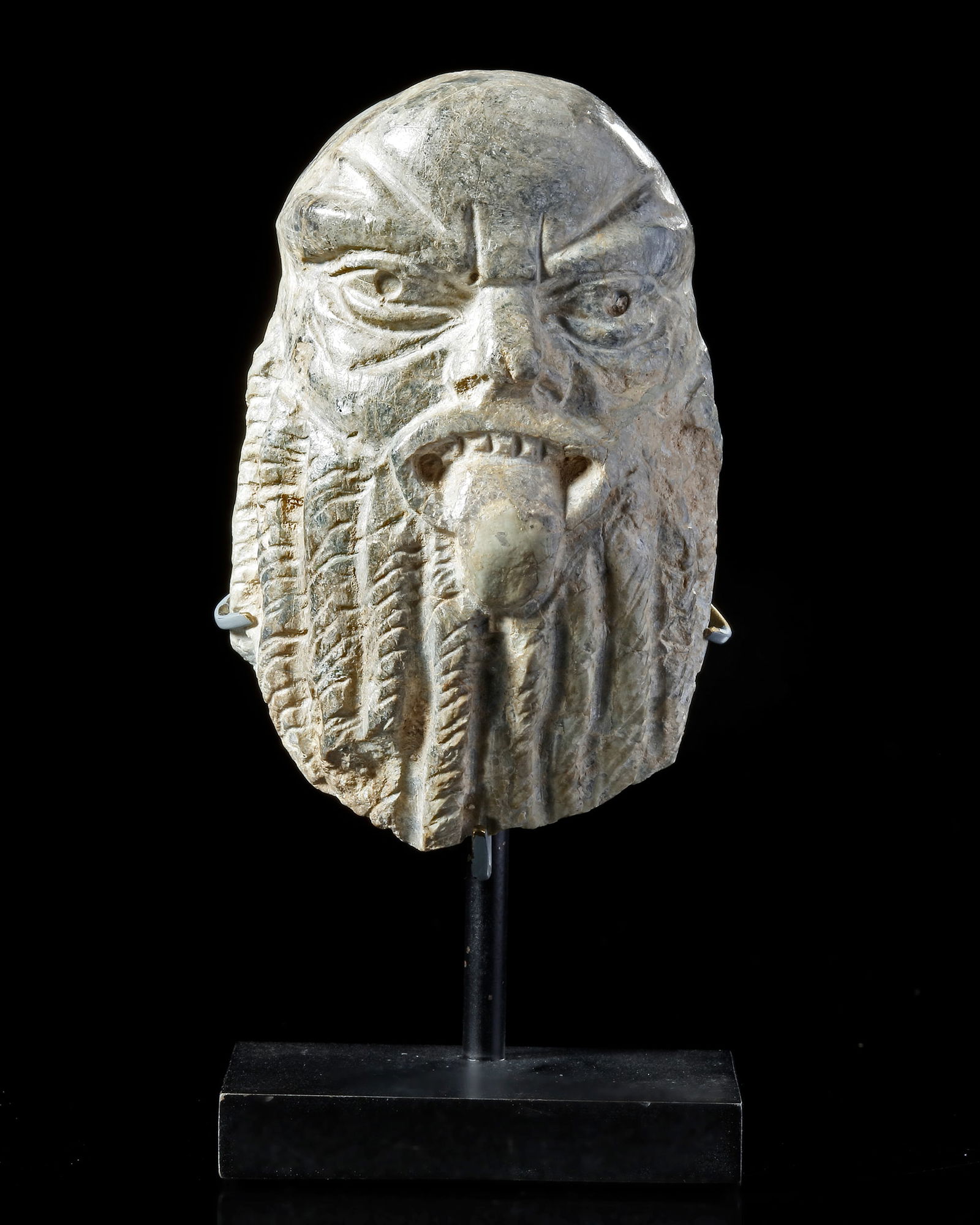 A SMALL STONE CARVED HEAD OF BES (1 of 3)