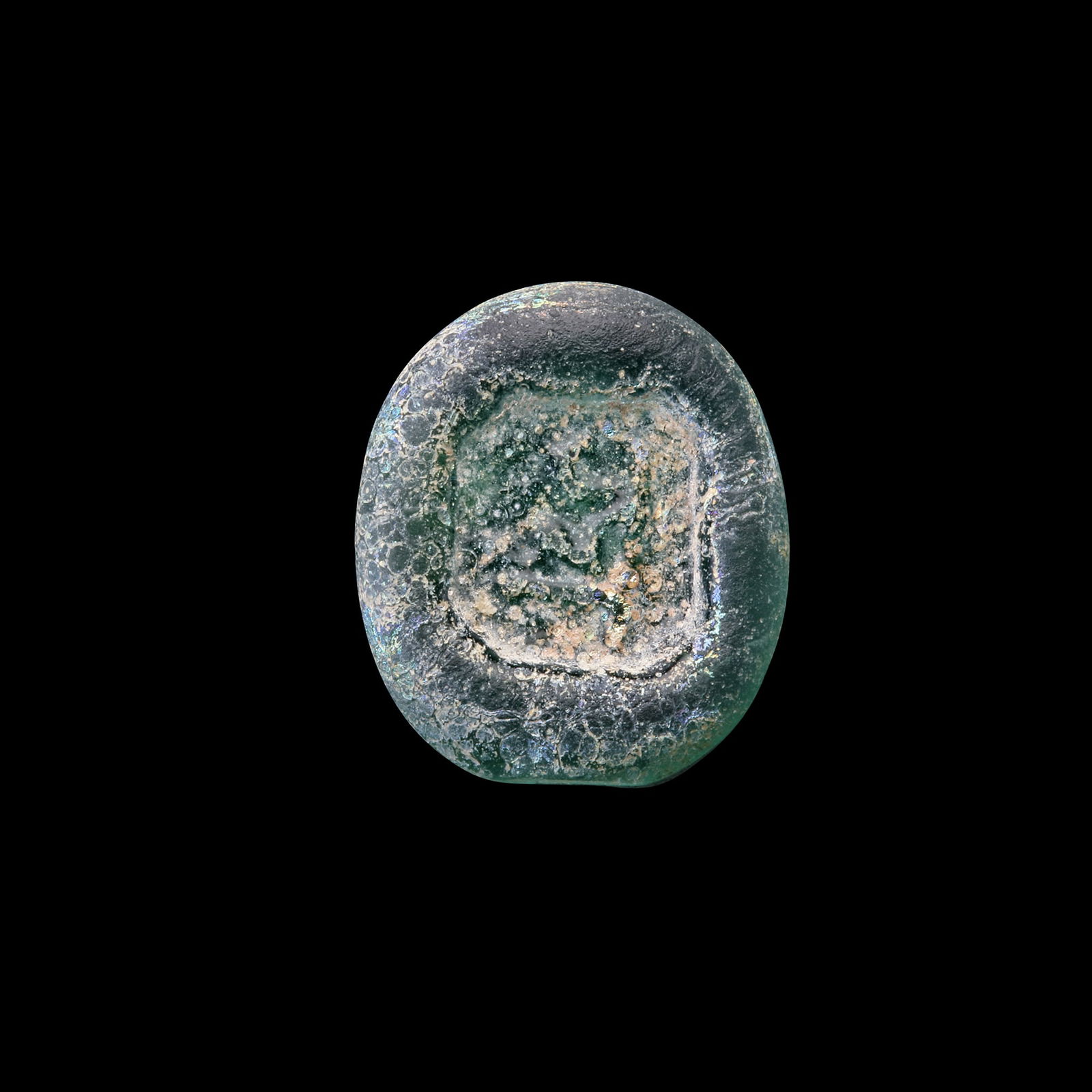 AN EARLY ISLAMIC GLASS WEIGHT OF HALF DIRHAM, 10TH-11TH CENTURY: Glass weight, moulded and stamped, transparent light-green in colour, citing in the centre with " Adl, Justice". 1,425g,15 mm. coin weight: half dirham. N 158