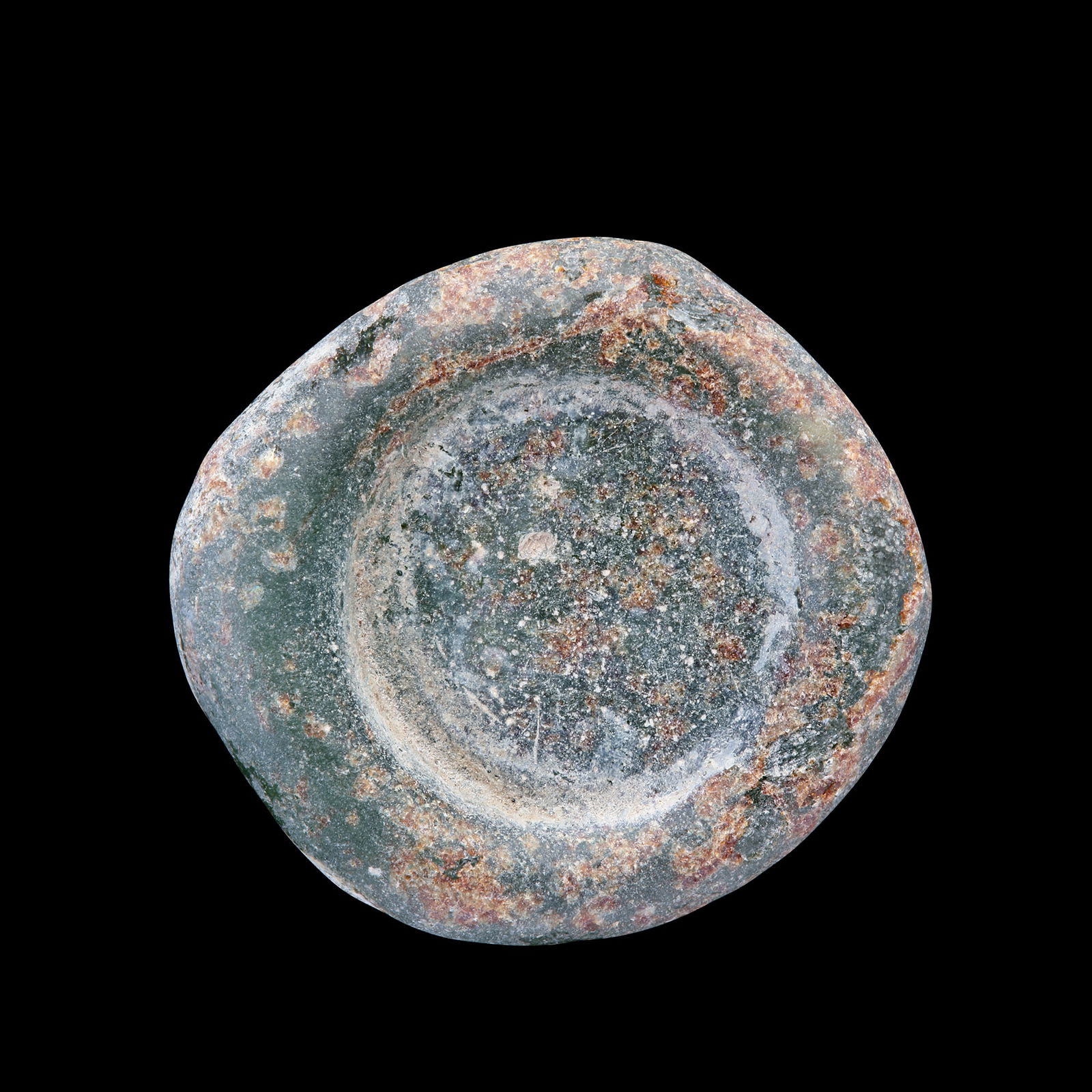 AN EARLY ISLAMIC GLASS WEIGHT OF DOUBLE DIRHAM, 10TH-11TH CENTURY: Glass weight, moulded and stamped, transparent light-green in colour, citing in the centre with 2 lines of undeciphered Arabic text. 5.667g, 26 mm. coin weight: double dirham.
