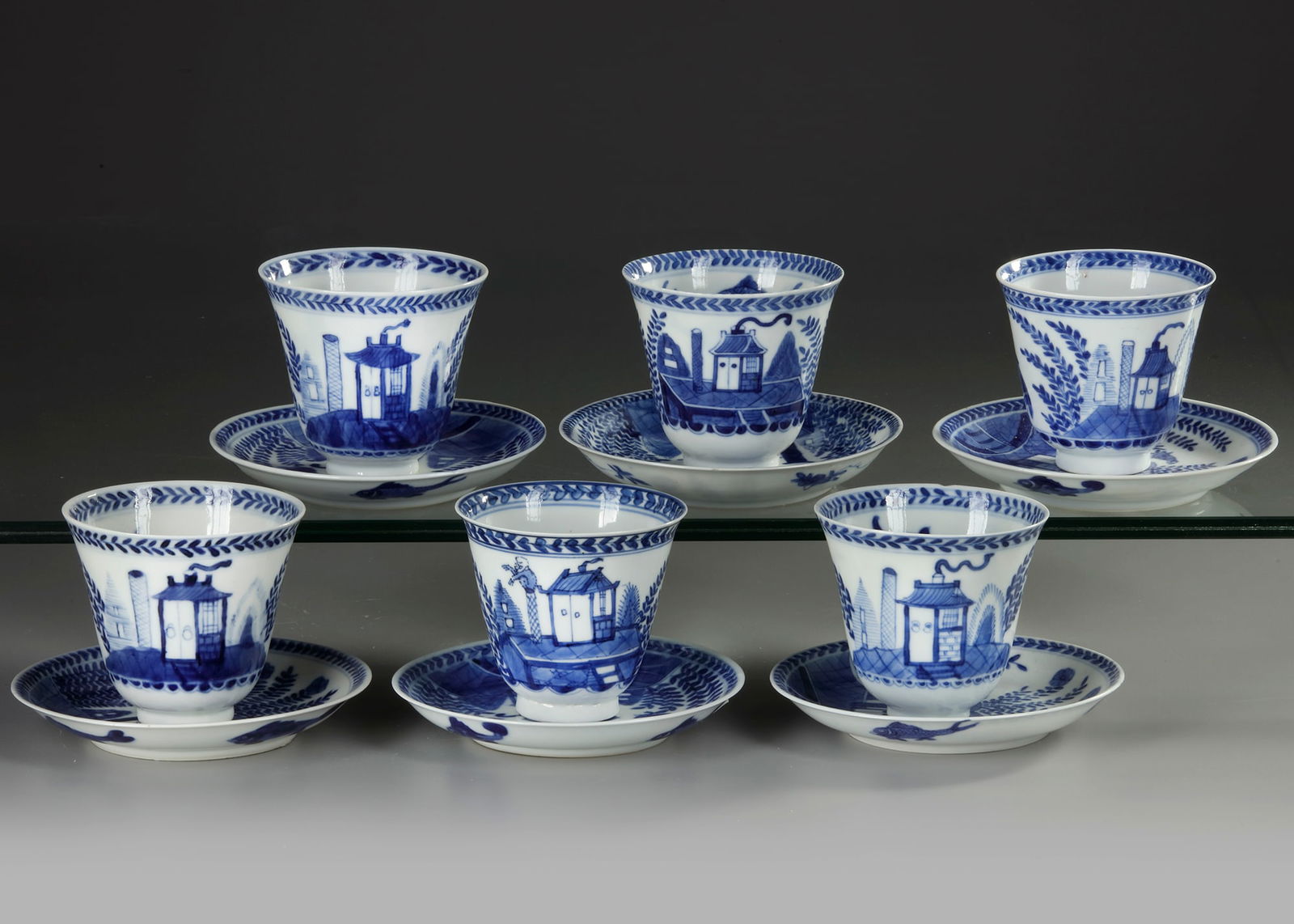 SIX CHINESE BLUE AND WHITE 'CUCKOO IN THE HOUSE' CUPS AND SAUCERS, 18TH CENTURY (1 of 3)
