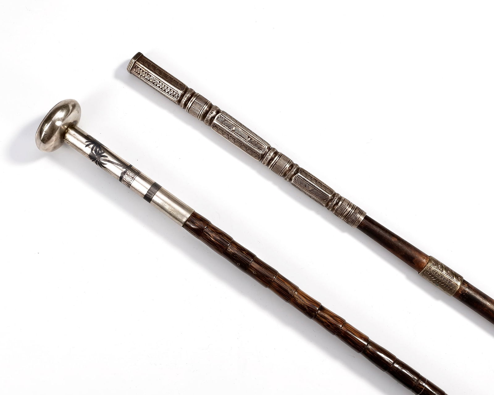 TWO SILVER-MOUNTED CANES, IRAQ, 20TH CENTURY (1 of 2)