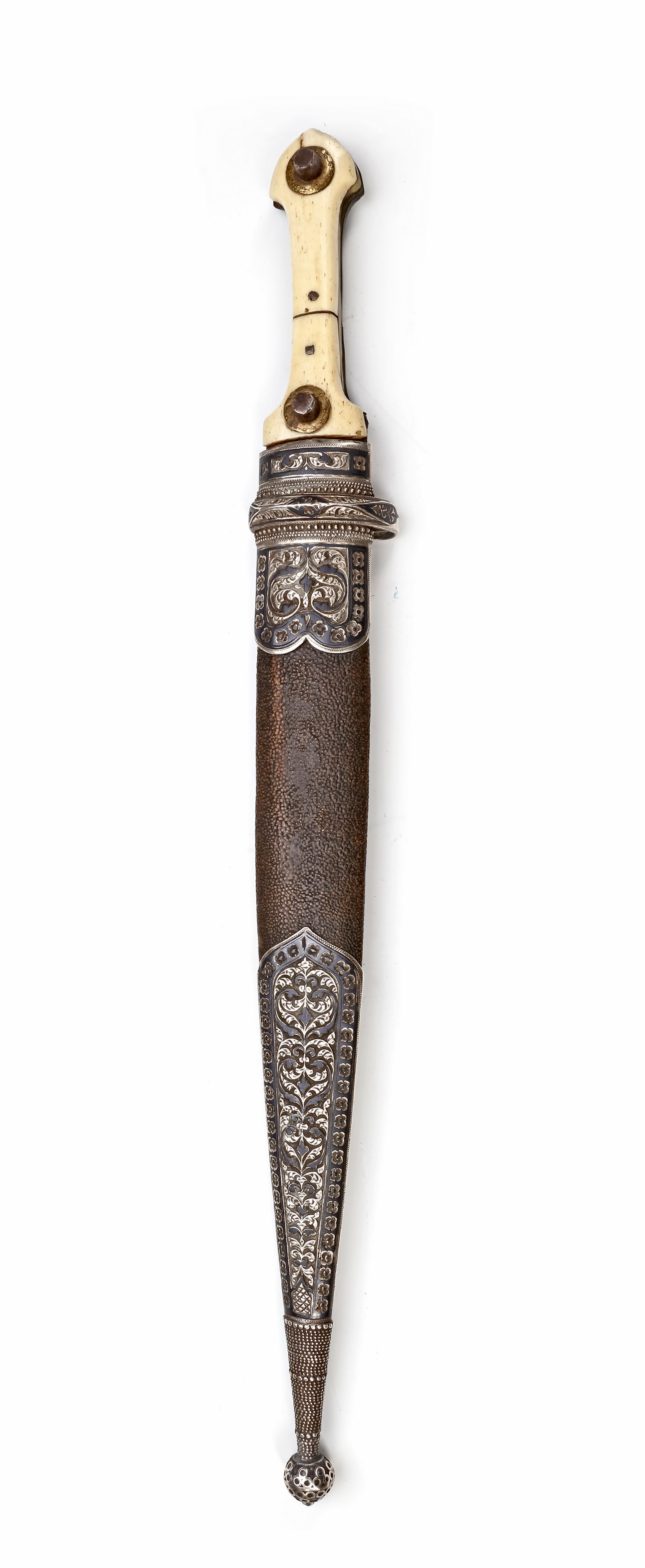 LARGE NIELLO SILVER-MOUNTED KINDJAL DAGGER â€“ CAUCASUS, 19TH CENTURY: A finely crafted 19th-century Caucasian kindjal dagger with a steel blade, bone grip, and richly decorated niello silver mounts. The scabbard features intricate floral designs, 48 by 6 cm. 405 gr.